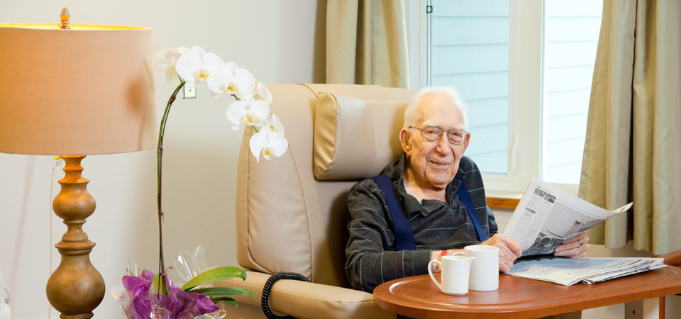 North Shore Hospice Man with Paper